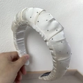 Padded beige satin headband with sparkling rhinestones and elegant pleated design - Off White