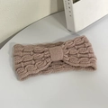 Winter cable-knit headband in dusty rose pink featuring a soft bow-knot design - Pink
