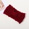 Winter cable knit headband in burgundy red featuring a decorative front twist knot - Red