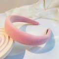 Detail of pink padded headband showing textured knit fabric and premium thick sponge core - Pink