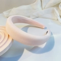 Macro detail of the light pink textured fabric on a thick padded headband for women - Lotus Pink