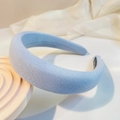 Detail view of the light blue padded sponge headband with premium knitted fabric texture - Sapphire Blue
