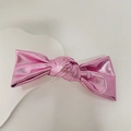 Pink PU leather metallic bow hairband with glossy texture on white wave display stand - Pink Bowknot Spring Clip