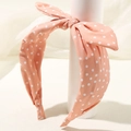 Cerchietto rosa a pois con fiocco incrociato, accessorio per capelli in tessuto chic - Rosa
