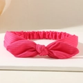 Detailed view of magenta textured bow headband with elastic band and soft ribbed fabric - Rose Red