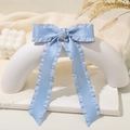 Light blue ruffled satin bow hair clip with long ribbons on a white display stand - Lh240315-7h