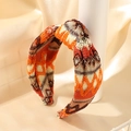 Bohemian orange and brown geometric knit headband with a knotted twist design - Orange Brown Geometric (E)