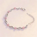 Elegant wave-link silver bracelet featuring pink square-cut crystal stones for women - Pink