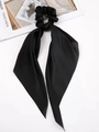 Elegant black satin ribbon scrunchie for ponytails with long bow streamers on white books - Black