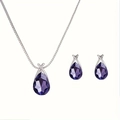 Macro detail of tear drop purple crystal necklace and earrings set with silver finish - Purple
