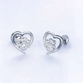 Detailed view of silver heart stud earrings with sparkling cubic zirconia dog paw motif - Hollow Heart Clear Paw / White