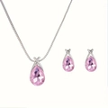 Close-up of elegant silver necklace and stud earrings with pink teardrop crystals - Pink