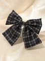 Elegant black and white checkered bow hair claw clip on soft champagne silk fabric - Black Plaid Bow Hair Clip