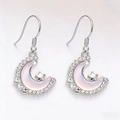 Detail of silver crescent moon earrings with opal inlay and sparkling star accents - Hook Style / Pink Earrings
