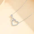 Minimalist silver heart infinity necklace with cubic zirconia on a beige backdrop - Silver Single Row