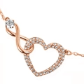 Macro detail of rose gold infinity heart pendant with sparkling cubic zirconia pavé setting - Rose Gold Double Row