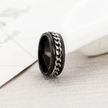Macro shot of rotatable stainless steel chain ring with engraved industrial gear edges - US 6 / Steel