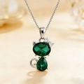 Silver cat necklace with emerald green crystals and a sparkling bow pendant - Necklace / Green