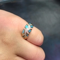 Macro detail of gold vintage ring with blue inlay stones and crossed zircon rows - US 5 / Gold