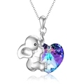 Silver elephant necklace with heart-shaped gradient crystal pendant on white background - Elephant Holding Heart