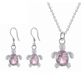 Detailed view of turtle jewelry set featuring pink crystal stones and silver textures - Pink
