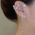 Detail showing butterfly ear cuff with dangling rhinestone tassels and silver finish - Silver Right Ear