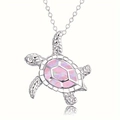 Macro shot of a sea turtle pendant with vibrant pink opal inlay and silver chain - Chain Only / Pink
