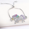 Detailed shot of an adjustable unicorn bracelet with colorful rhinestones on a silver chain - Silver Bracelet