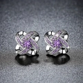 Elegant silver four-petal flower stud earrings with purple zircons on dark background - Four-petal Swirl Flower / Purple