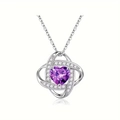 Macro view of purple heart-shaped stone pendant with sparkling pavé zircon setting - February - Purple Amethyst