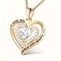 Detailed macro of rose gold heart pendant with I love you forever engraving and zircon - April-White