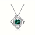 Close-up of green heart gemstone necklace with twisted silver knot and crystals - May-Green