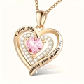 Macro shot of rose gold heart necklace with pink crystal and I love you forever engraving - October-Pink