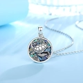 Detailed view of turtle pendant featuring colorful abalone shell inlay on silver chain - Seagrass Round Turtle Necklace