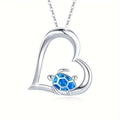 Silver turtle heart necklace with blue opal inlay in a delicate marine style design - Blue