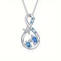 Elegant silver infinity necklace featuring sea turtles, starfish, and blue gemstones - Silver