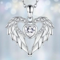 Elegant heart zircon angel wing pendant necklace in silver finish on bokeh background - Necklace / Silver