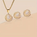 Macro shot of elegant gold pearl necklace and earrings set with shimmering zircon details - White (Set)
