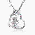 Detail of silver unicorn heart necklace with colorful pink and blue crystals - Silver