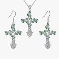 Detailed macro view of the celtic cross jewelry set with green leaf enamel details - Necklace & Earrings / Silver