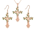 Detailed view of rose gold Celtic cross jewelry set with green enamel vine leaves - Necklace & Earrings / Rose Gold