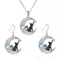 Detail of silver cat and moon jewelry set featuring a blue gemstone and Celtic knots - Necklace & Earrings