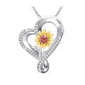 Macro view of heart sunflower pendant with crystal border and red center gemstone - Two Colors