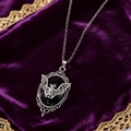 Gothic vampire bat necklace with black gem on purple velvet background, creative jewelry - Necklace / Black