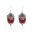 Detail view of Gothic vampire bat earrings with a red oval gemstone in silver frame - Earrings / Red