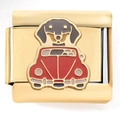 Macro view of gold stainless steel charm featuring a black dachshund in a red vintage car - Dachshund in Red Car Gold (4219)