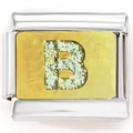 Macro shot of 9mm stainless steel modular charm link with a golden glittery letter B charm - Zircon Letter B Gold Base