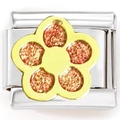 Macro shot of stainless steel Italian charm link featuring a gold flower with red glitter - Gold-Tone Red Zircon Petals
