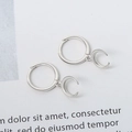 Minimalist S925 sterling silver hoop earrings featuring a polished crescent moon pendant - Platinum
