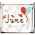 Macro view of June birthday charm link with blue heart and colorful balloons - June